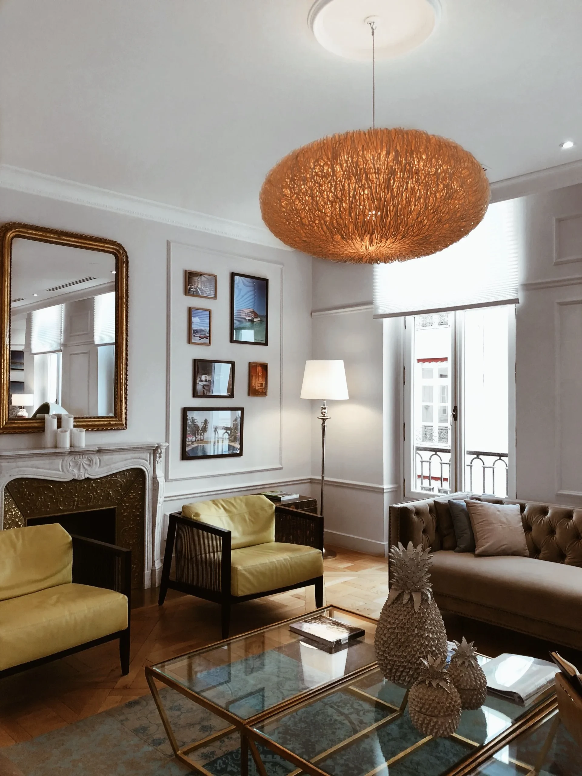 Elegant hotel-inspired living room with sophisticated furniture and layered lighting