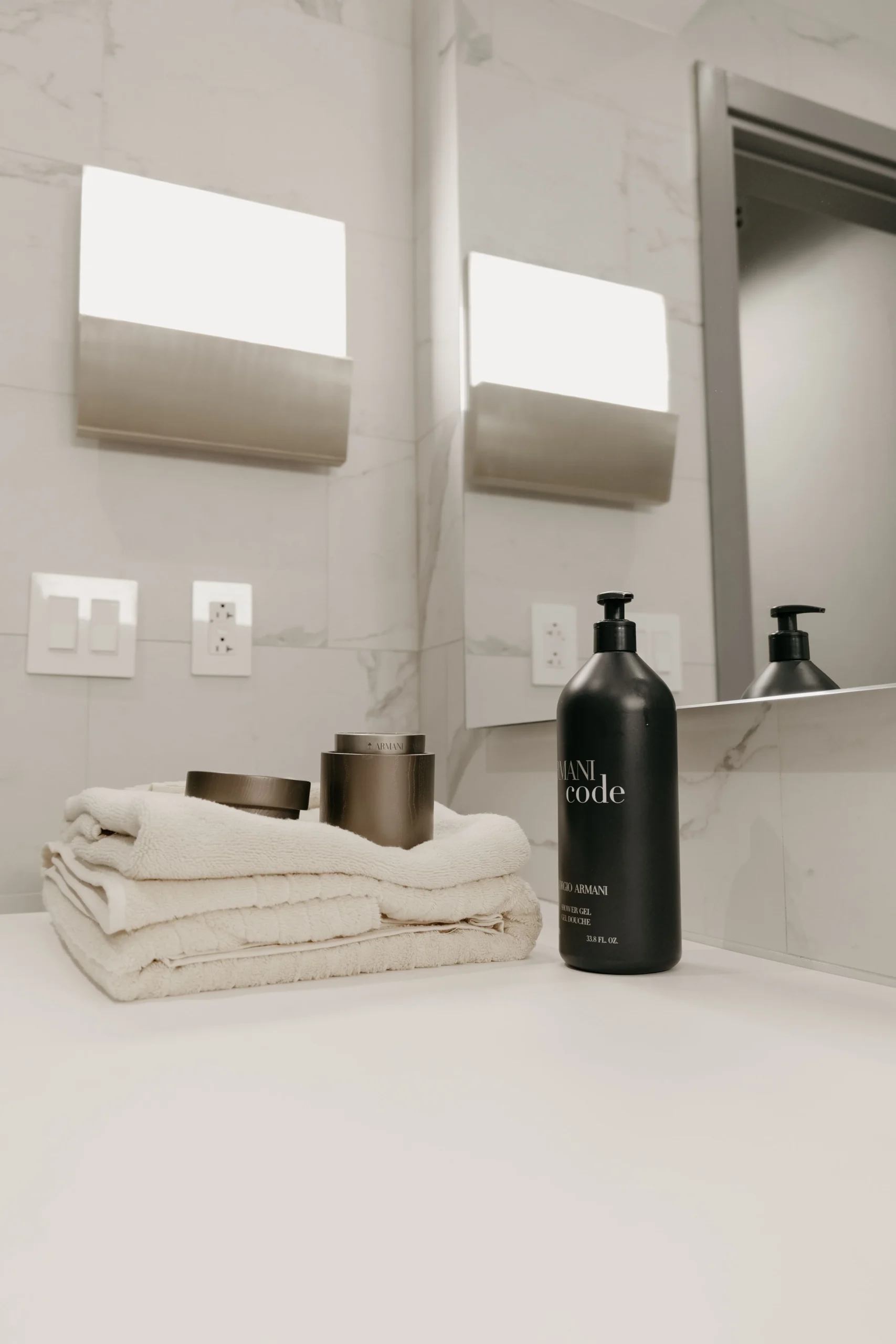 Neatly styled bathroom with towels and toiletries for a luxurious look